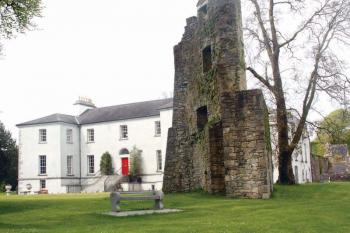 Castlecoote House, an historic Georgian mansion in Co. Roscommon, is open for B&amp;amp;amp;B from April 1 until the end of September. In the foreground is a 16th Century castle tower. 	Judy Enright photos
