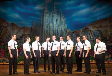 Jake Emmerling (third from left) with the cast of the national touring company of “The Book of Mormon,” playing the Citi Emerson Colonial Theatre through October 11. 	Photo © Joan Marcus, 2014