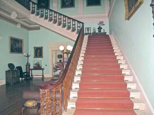 The elegant entrance hall, adorned with Perceval family portraits, at Temple House in Ballymote, Co. Sligo. Temple House is one of 36 select and historic private homes in Hidden Ireland (hiddenireland.com), a group that welcome guests for a unique and extraordinary B&amp;amp;amp;B experience. (Judy Enright photos)